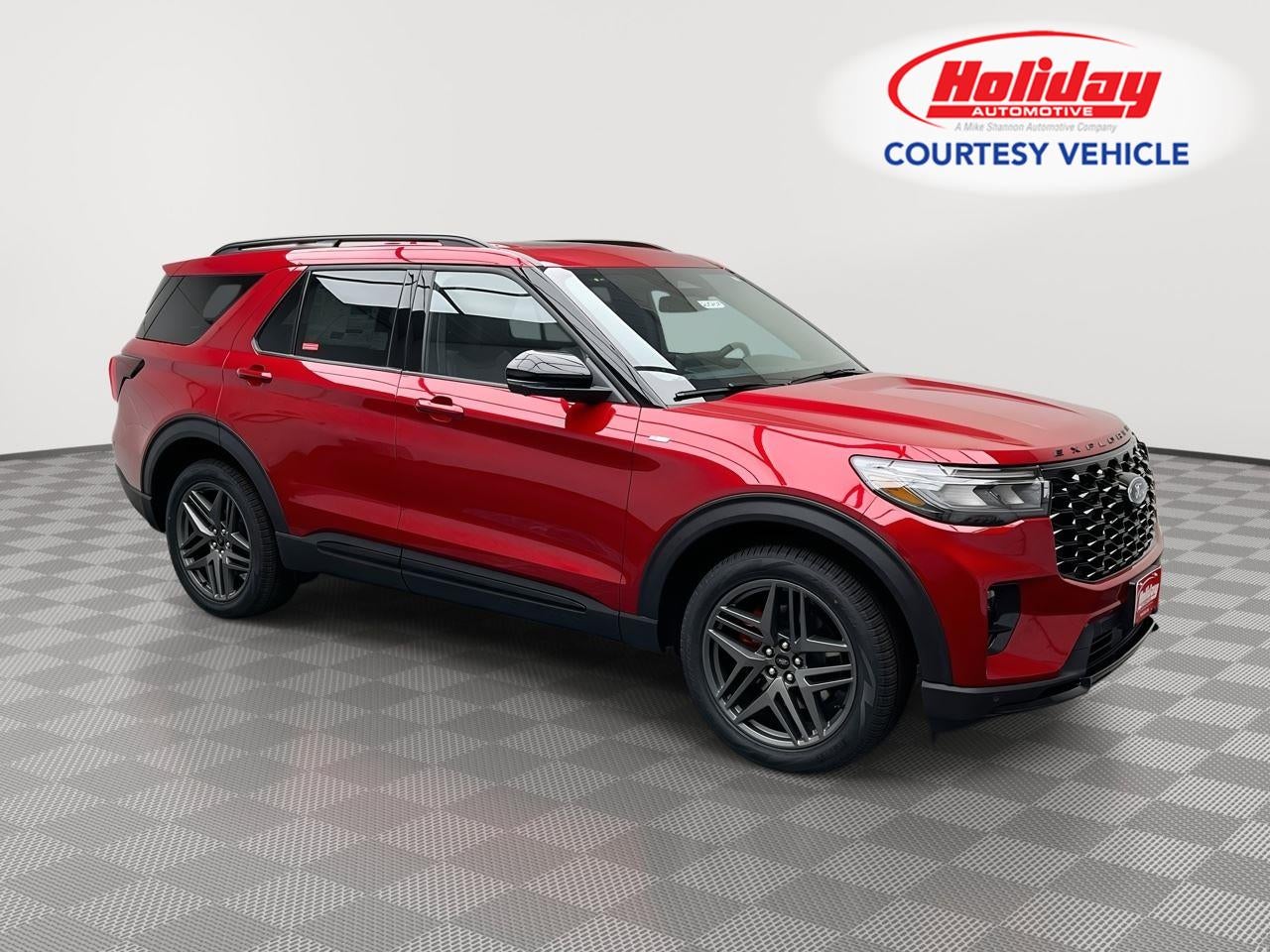2026 Ford Explorer ST-Line in Rapid Red Metallic Tinted Clearcoat — front three-quarter view