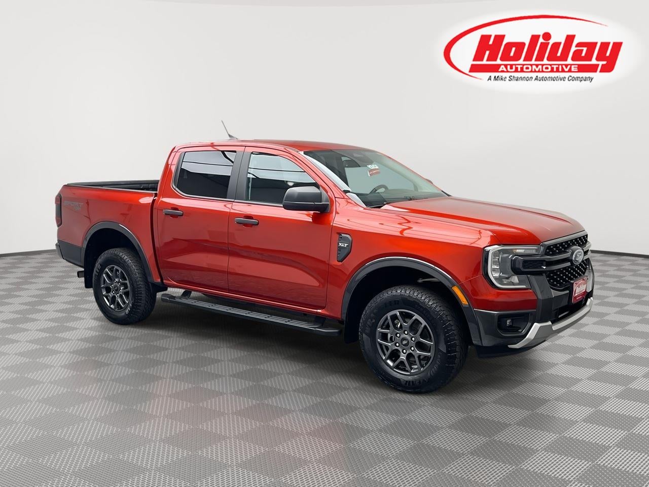 2024 Ford Ranger XLT in Hot Pepper Red Metallic Tinted Clearcoat — front three-quarter view