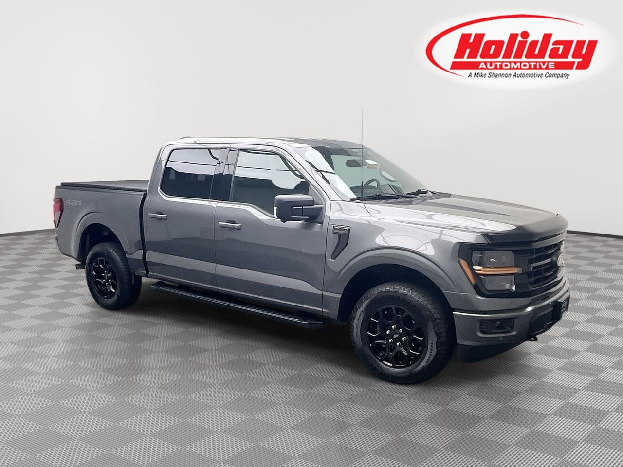 2024 Ford F-150 XLT in Carbonized Gray Metallic — front three-quarter view