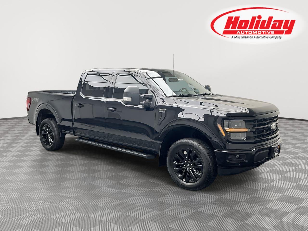 2024 Ford F-150 XLT in Agate Black Metallic — front three-quarter view