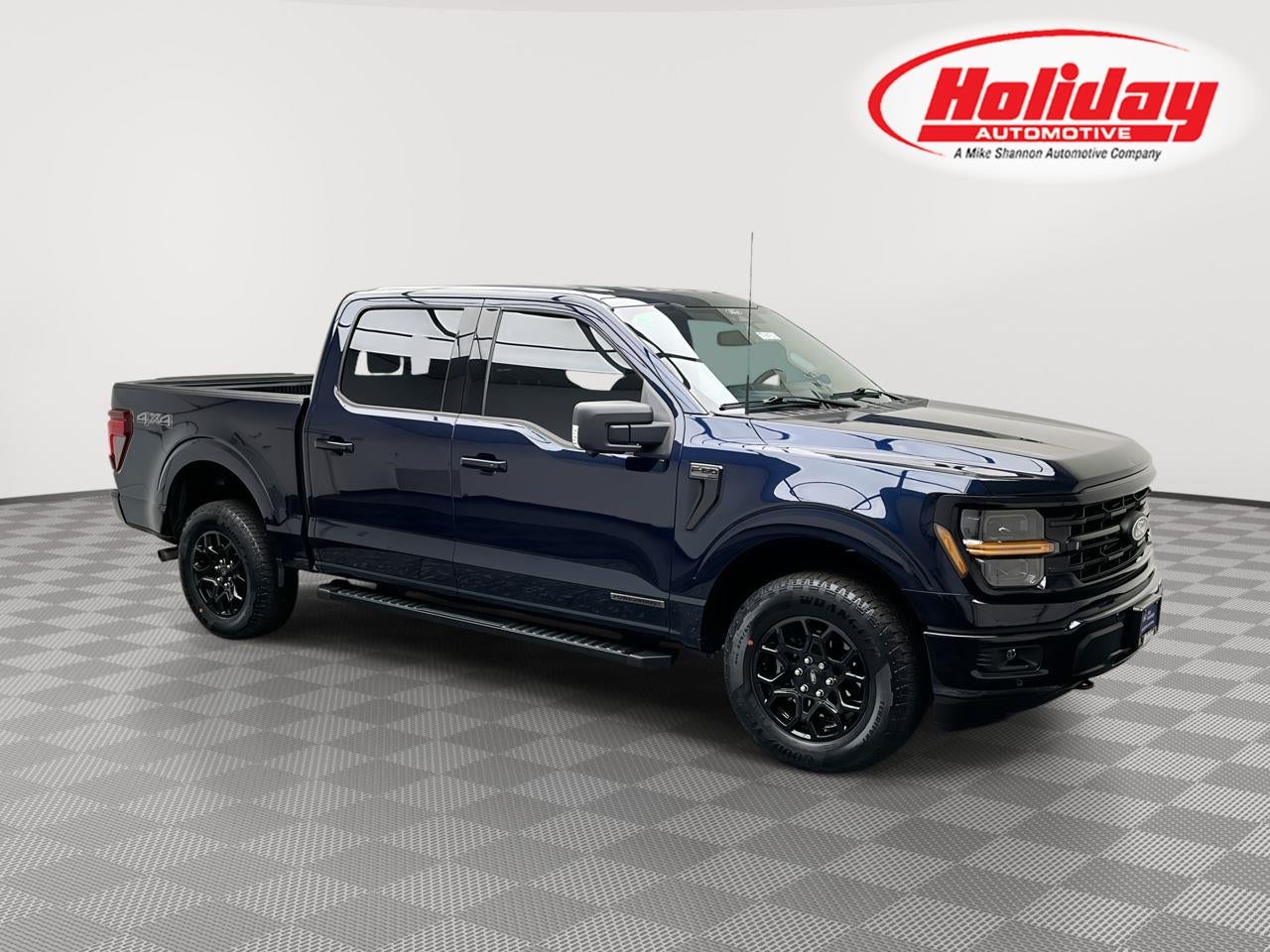 2024 Ford F-150 XLT in Antimatter Blue Metallic — front three-quarter view