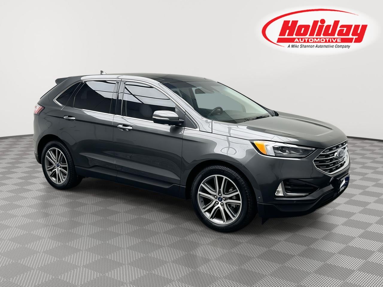 2019 Ford Edge Titanium in Magnetic Metallic — front three-quarter view