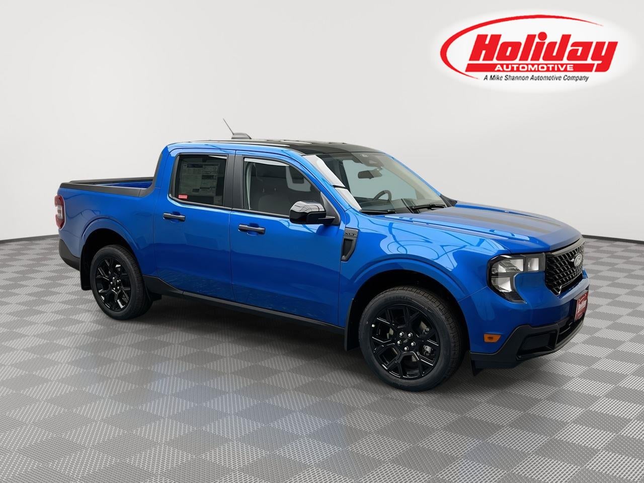 2026 Ford Maverick XLT in Velocity Blue — front three-quarter view