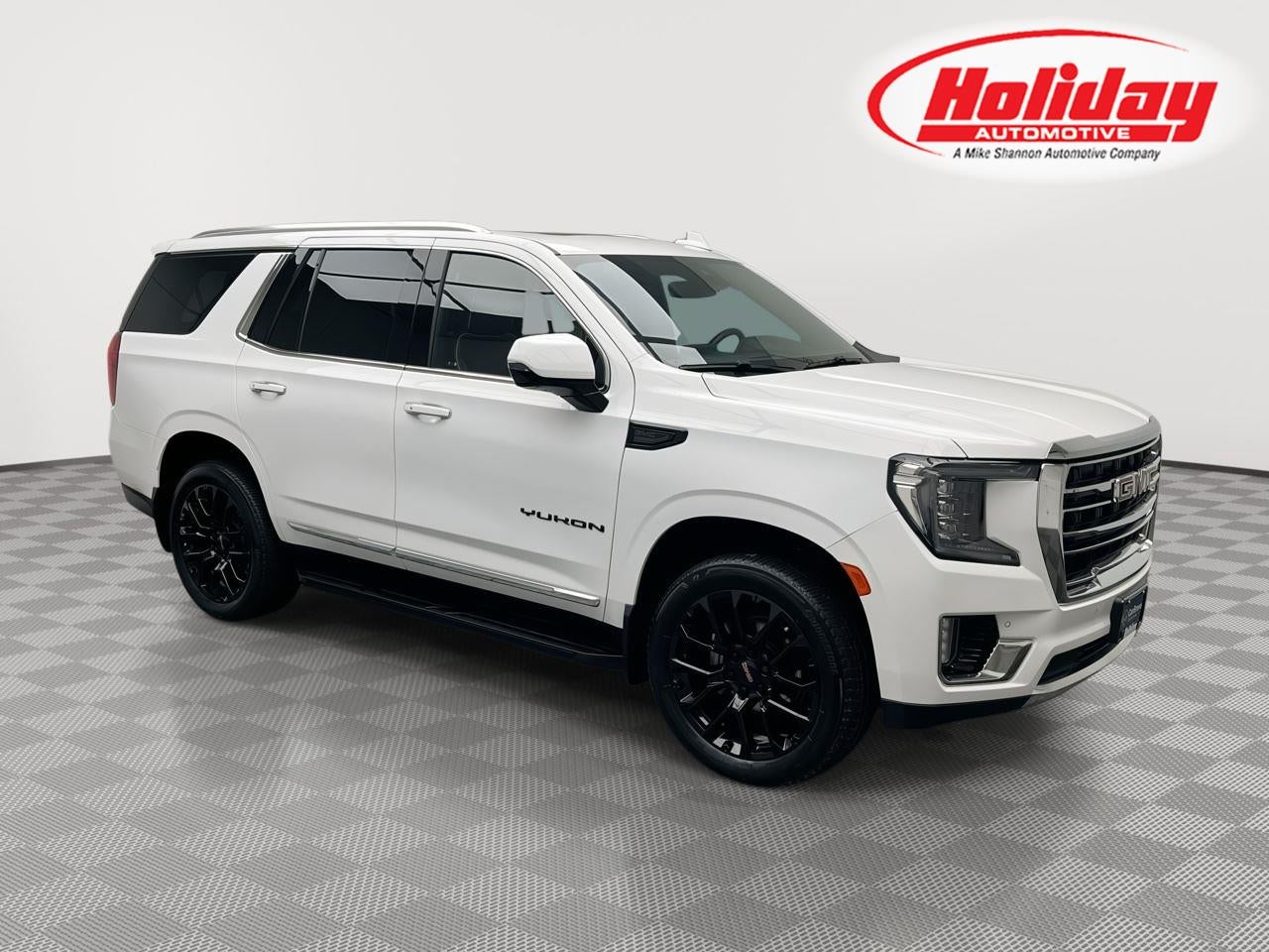 2024 GMC Yukon SLT in Summit White — front three-quarter view