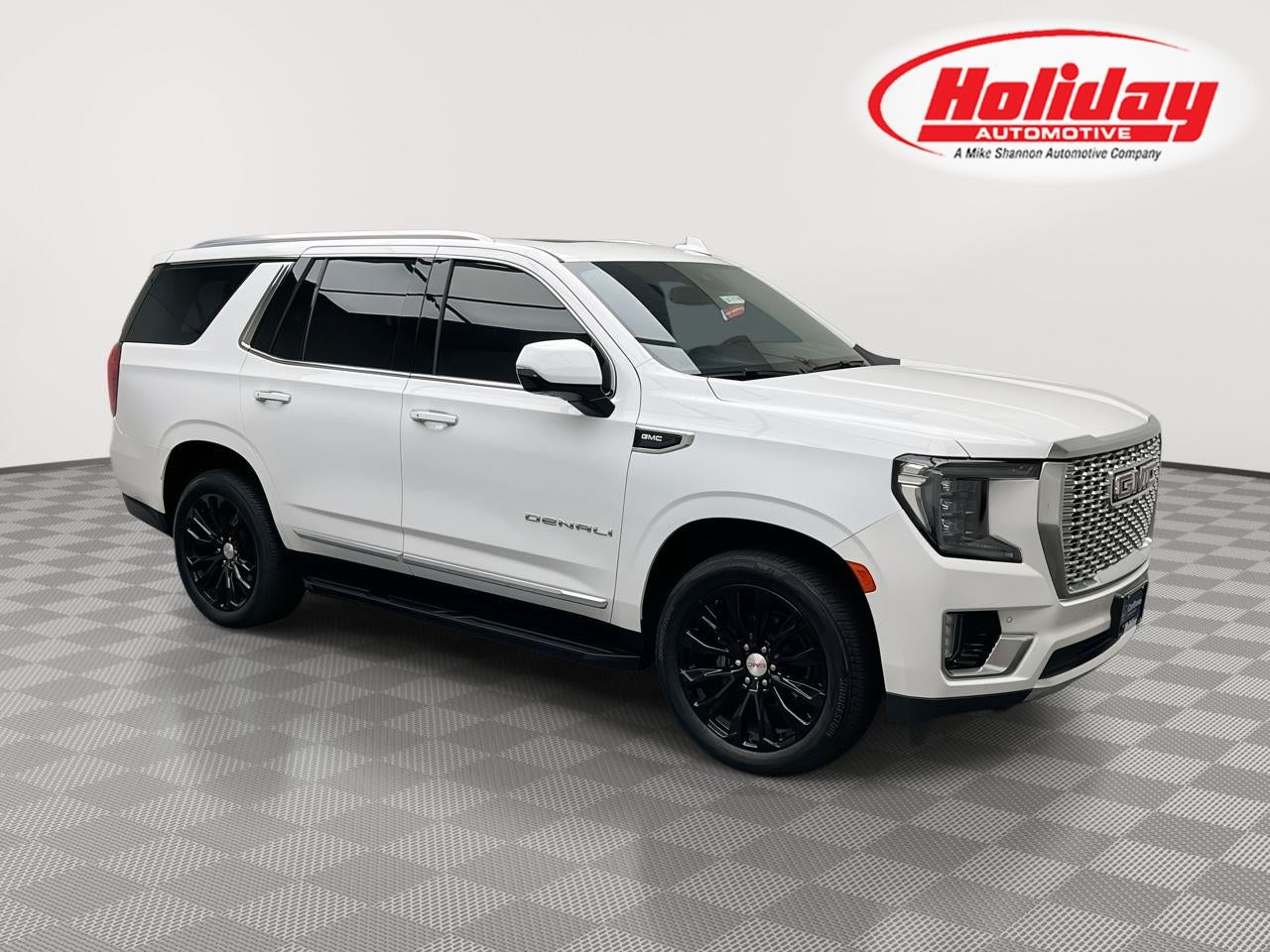 2023 GMC Yukon Denali in Summit White — front three-quarter view