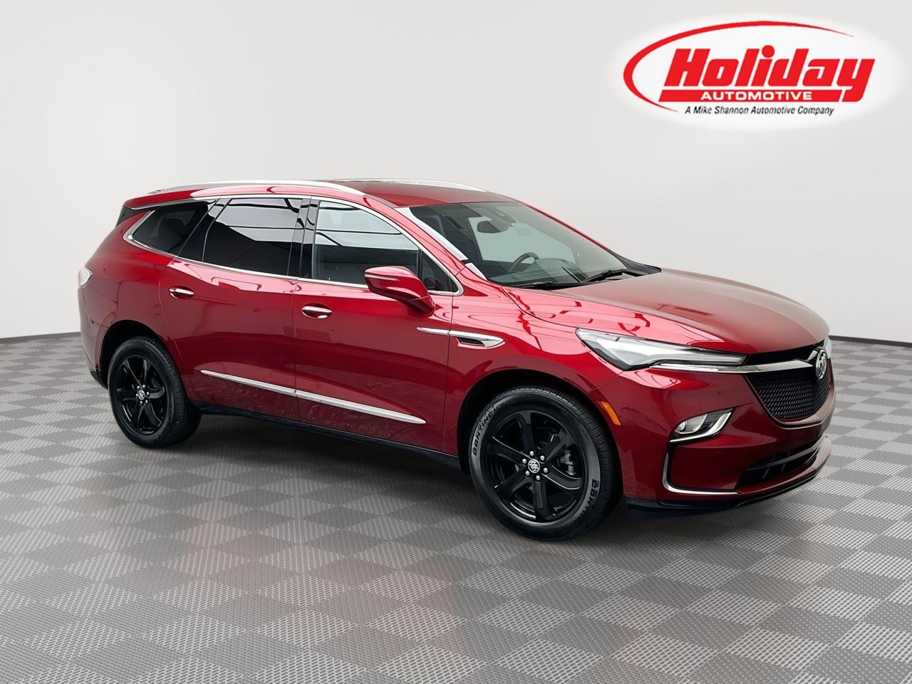 2023 Buick Enclave Essence in Cherry Red Tintcoat — front three-quarter view