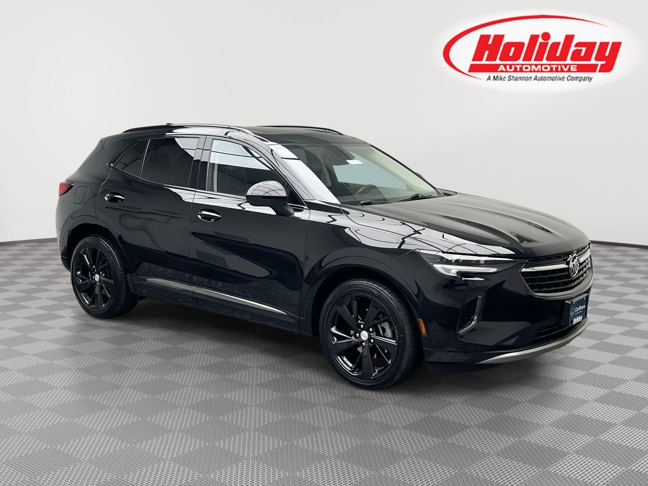 2021 Buick Envision Essence in Ebony Twilight Metallic — front three-quarter view