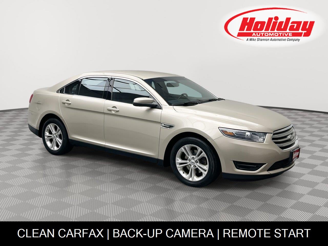 2017 Ford Taurus SEL in White Gold Metallic — front three-quarter view