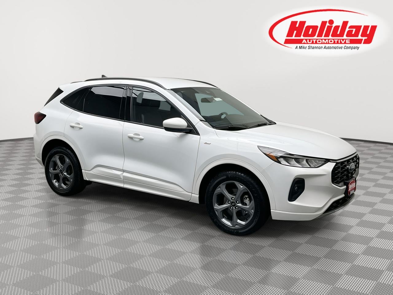 2023 Ford Escape ST-Line Select in Oxford White — front three-quarter view
