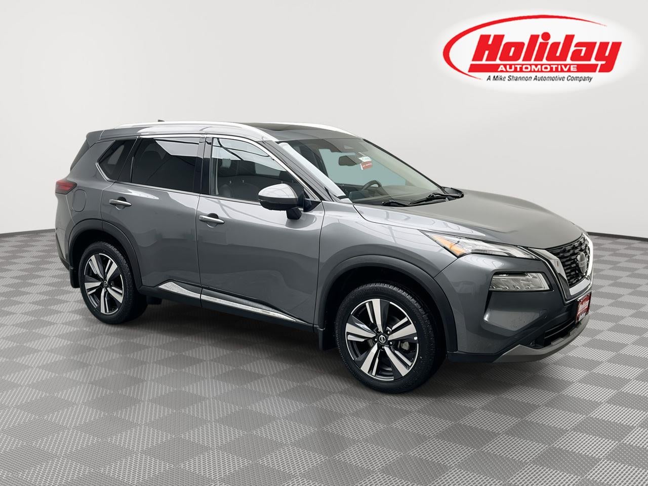 2021 Nissan Rogue SL in Gun Metallic — front three-quarter view